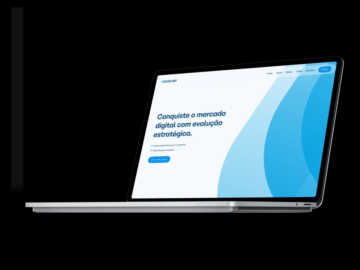 Site da Evolury exibido em um notebook.